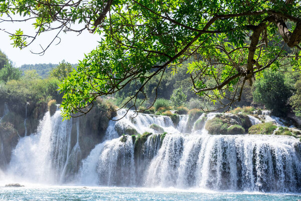 Breathtaking view Waterfalls of Krka National Park, Sunny day, summer season having greenery and trees, Croatia
