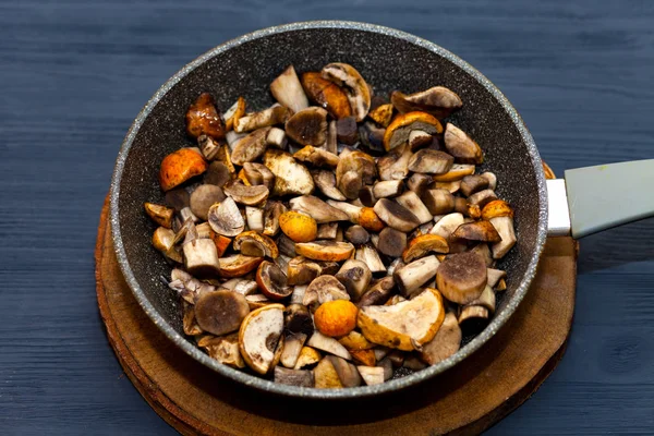 Cooking mushrooms in a pan. Fried mushrooms, boletus, orange-cap boletus.