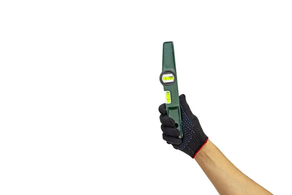 A man's gloved hand holds a spirit level — Stock Image A man's gloved hand holds a spirit level Stock Image