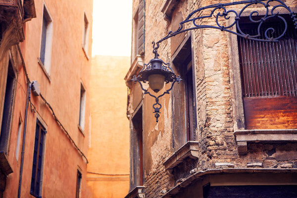 Details of old italian architecture and street lamp