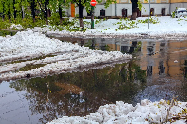 melting snow on the crossroad in the city