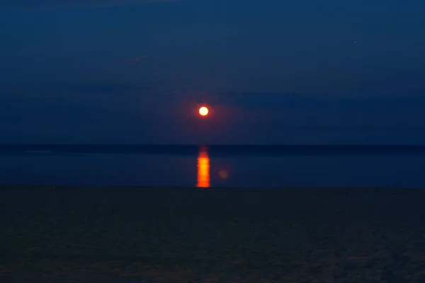 full moon over the sea in the midnight