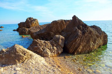 big natural rocks in the sea water