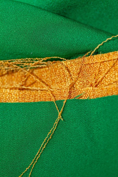 fabric pieces with threads and textile background