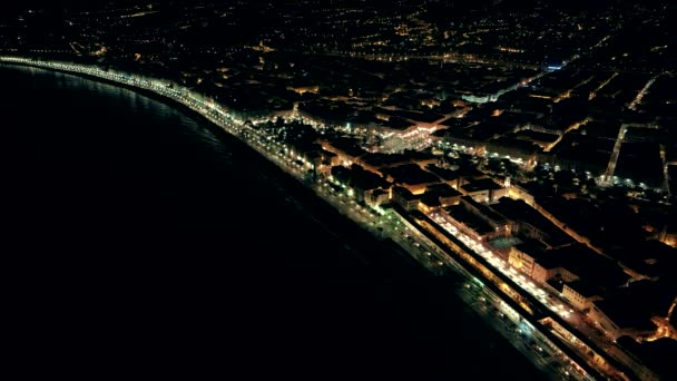 Night aerial view of illuminated Nice town in France. Flight over promenade. — Stock Video