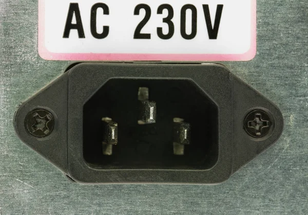 Closeup  of the electrical socket on the back of the computer power supply AC 230V