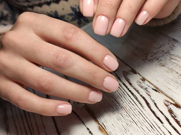 Trendy manicure design on a beautiful background.