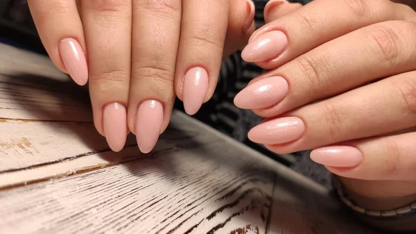 Fashionable beige manicure with a silver design — Stock Photo, Image