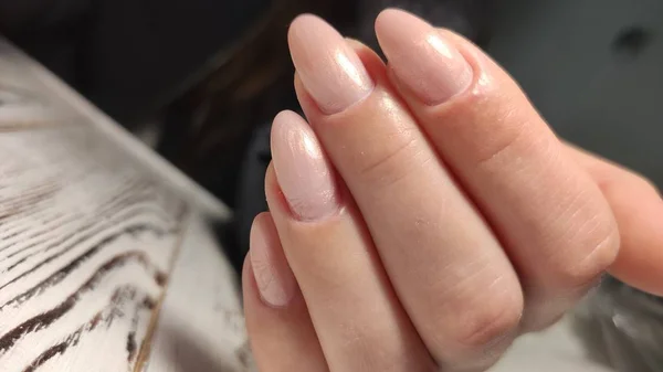 Fashionable beige manicure with a silver design — Stock Photo, Image