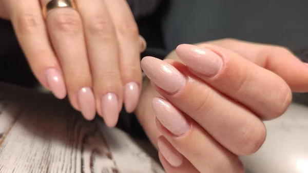 Closeup photo of a beautiful female hands with elegant manicure — Stock Photo, Image