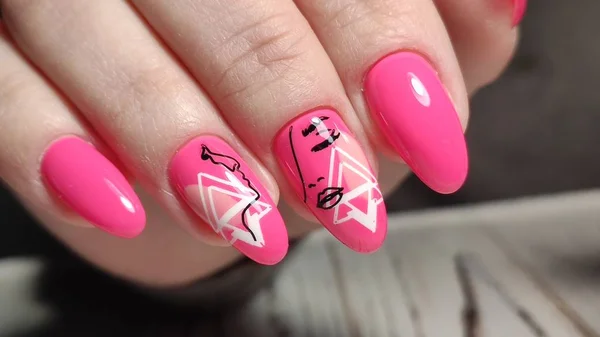 Sexy pink manicure on long beautiful nails — Stock Photo, Image