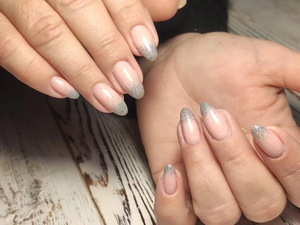 beautiful gel lacquer manicure on a textured trendy background