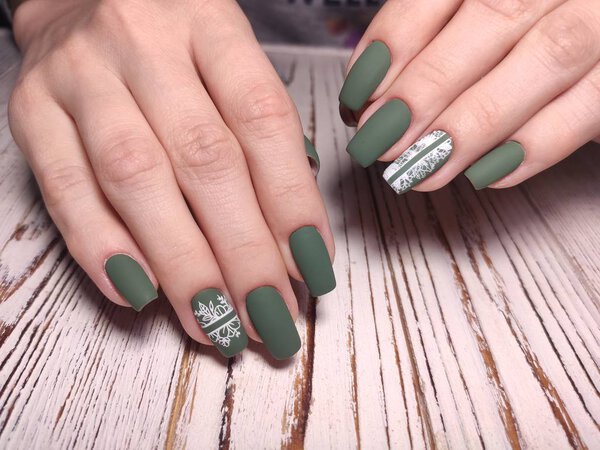 Beautiful woman's nails with beautiful christmas manicure studio