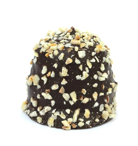 Chocolate coated cream puff with hazelnuts — Stock Photo, Image