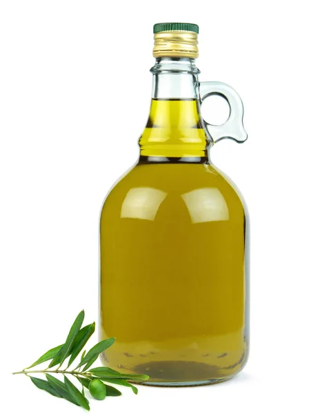 Extra virgin olive oil in glass bottle with green olive branch — Stock Photo, Image