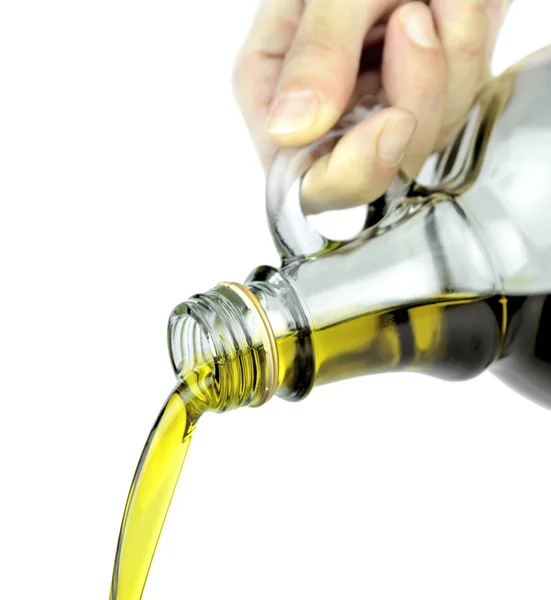 Verter aceite de oliva virgen extra de la botella de vidrio —  Fotos de Stock