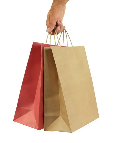 Muž ruka nese nákupní tašky — Stock fotografie
