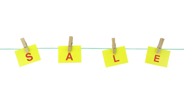 " SHOP " text on note papers hanging with pegs on rope — Stock Photo, Image