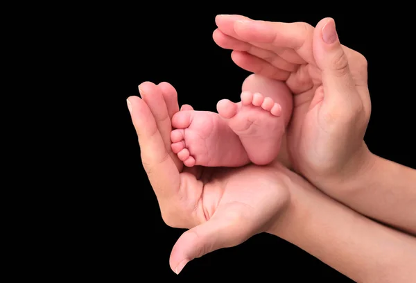 Baby foot in mother hands — Stock Photo, Image