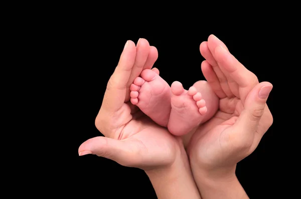 Baby foot in mother hands — Stock Photo, Image