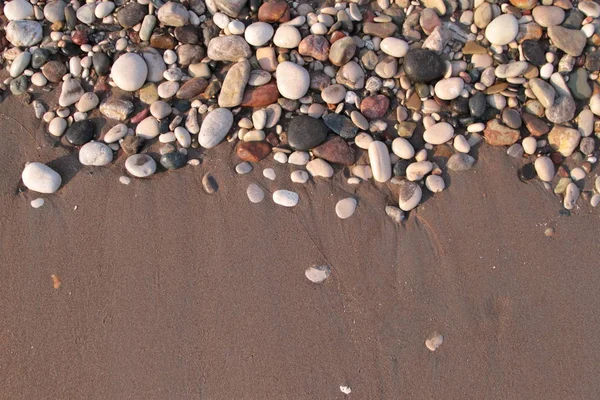 Pebble stenen en zand — Stockfoto