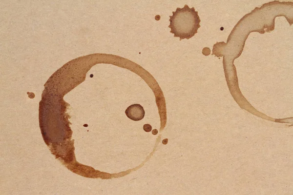 Coffee cup rings stains on a brown paper texture — Stock Photo, Image