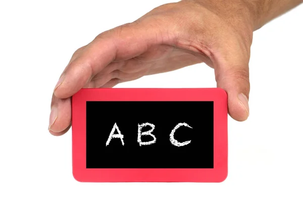 Mano sosteniendo y mostrando una tarjeta roja con texto "ABC" — Foto de Stock