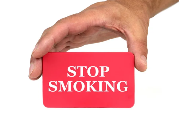 Hand holding and showing a red card with " STOP SMOKING " text — Stock Photo, Image