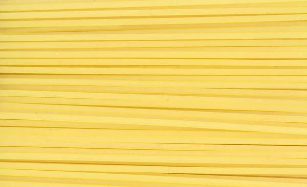 Uncooked long spaghetti — Stock Photo, Image