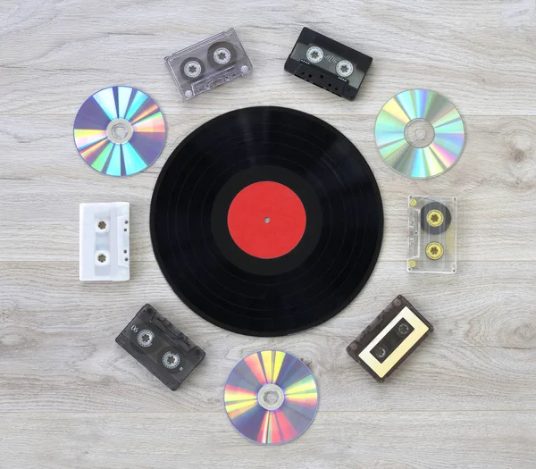Retro, vinyl record disc, audio cassette and cd — Stock Photo, Image