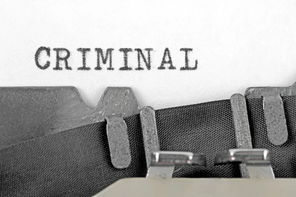 Criminal written on a old typewriter — Stock Photo, Image