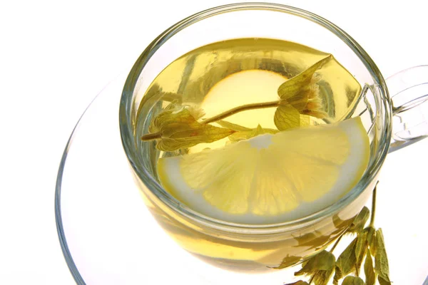 Herbal tea, sage leaves and lemon slice — Stock Photo, Image