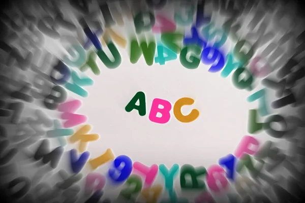 Colorful letters and numbers with zoom effect — Stock Photo, Image