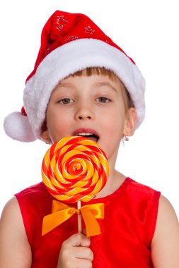 Küçük bir kız, Noel Baba şapkası şeker ile Noel portresi
