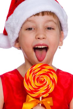 Küçük bir kız, Noel Baba şapkası şeker ile Noel portresi