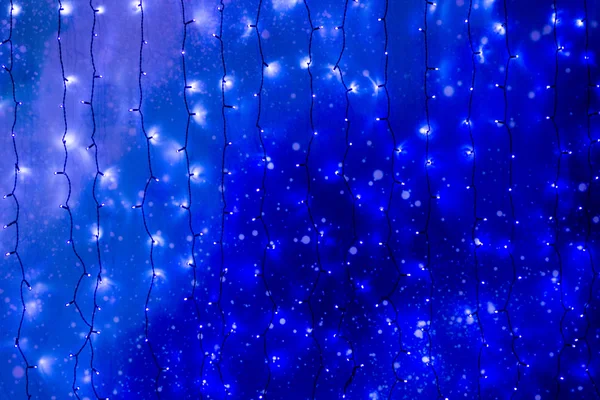 Christmas lights on dark blue background. Decorative garland — Stock Photo, Image