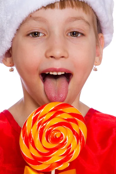 Küçük bir kız, Noel Baba şapkası şeker ile Noel portresi