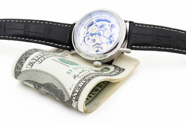 Relojes de pulsera y billetes de cien dólares sobre un fondo blanco — Foto de Stock