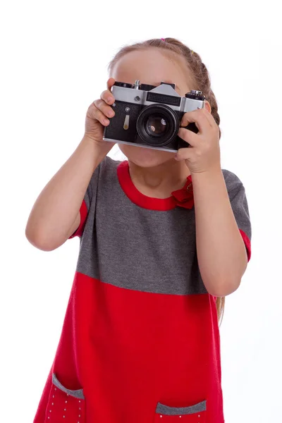 Mooi meisje vasthouden van de camera op witte achtergrond — Stockfoto