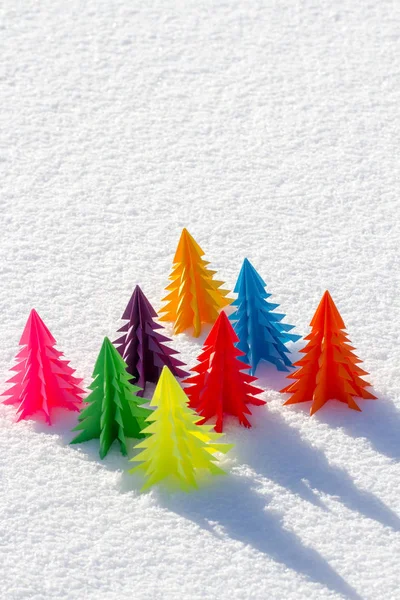 Colorful Christmas tree out of paper in the snow. — Stock Photo, Image