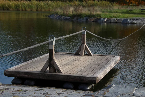 wooden raft with a rope for crossing to the other side