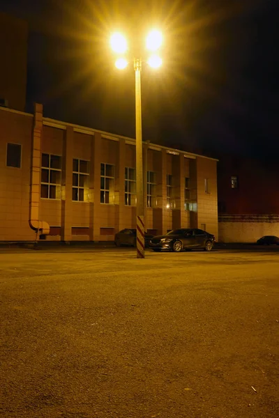 High Four Arm Street Lamp Illuminating Night Parking Lot Parked — 스톡 사진