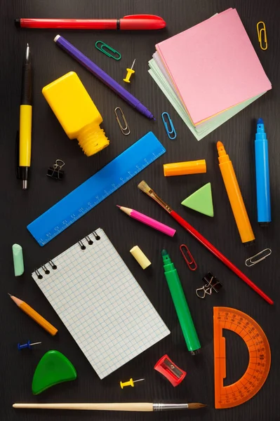 School supplies on black wood — Stock Photo, Image