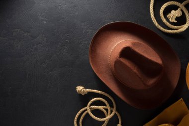 cowboy hat on wooden backgroun clipart