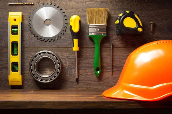 Tools and shelf at brown background — Stock Photo, Image