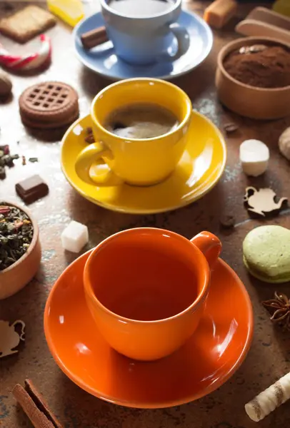 Cups of coffee, tea and cacao