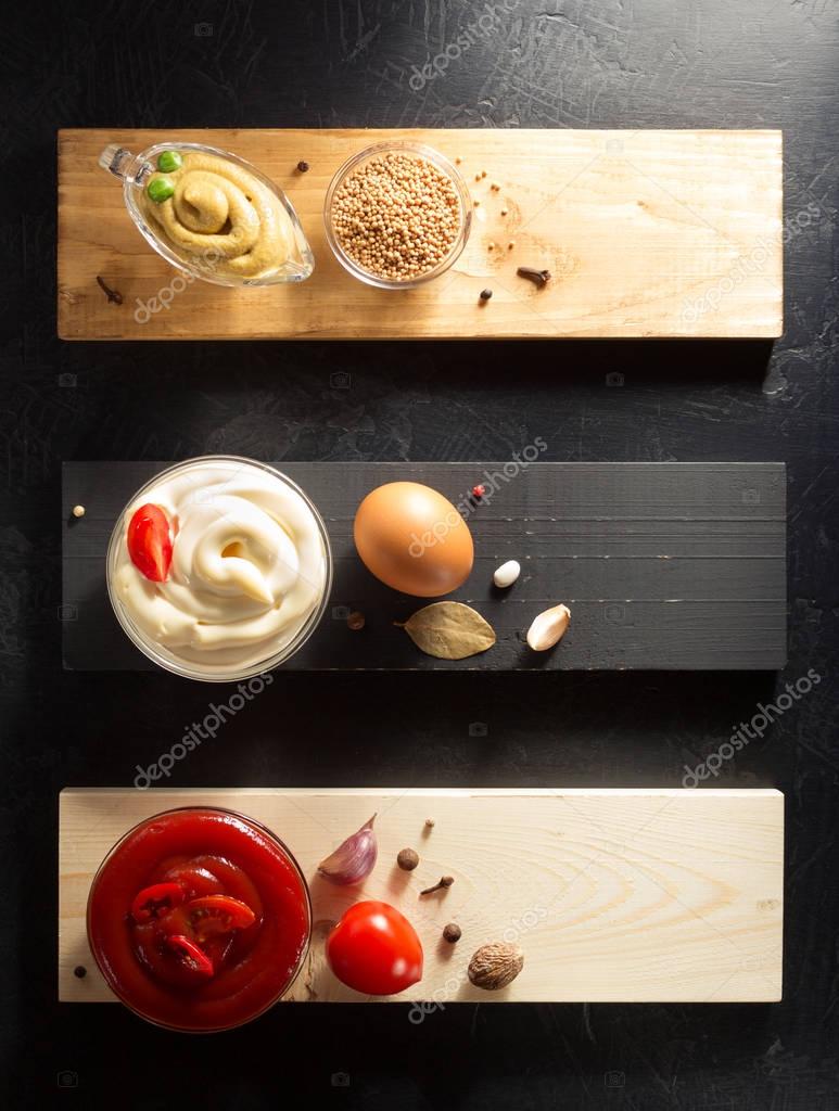 Tomato sauce, mayonnaise and mustard in bowls — Stock Photo © seregam
