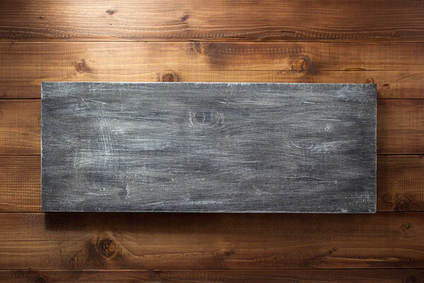 wooden board at brown background