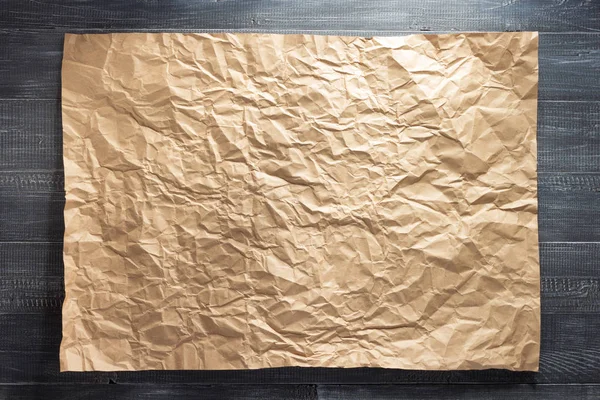 Sheet of paper at wooden background — Stock Photo, Image