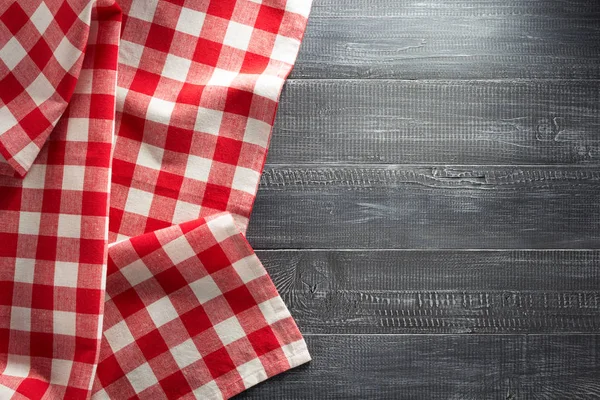 Cloth napkin checked on wood — Stock Photo, Image